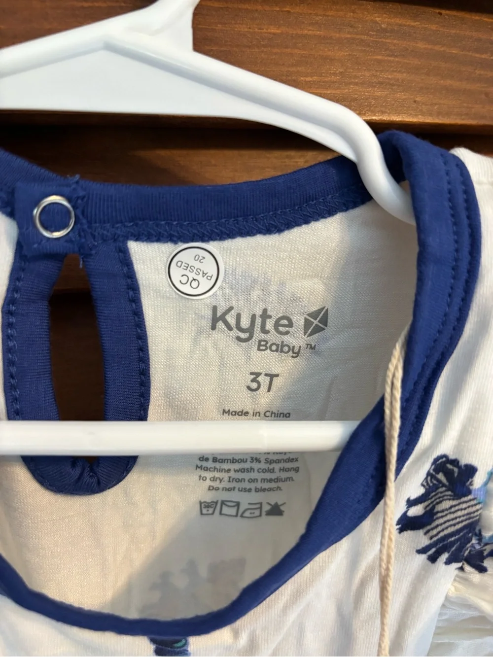 Kyte BABY White Romper with Navy Shell Print